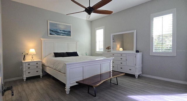 bedroom featuring dark hardwood / wood-style floors and ceiling fan