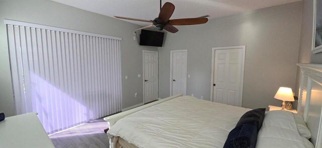 bedroom with ceiling fan and wood-type flooring