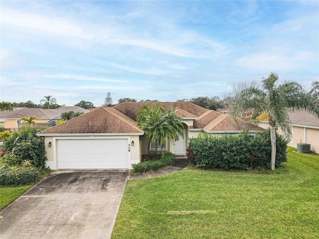 single story home featuring central AC, a front yard, and a garage