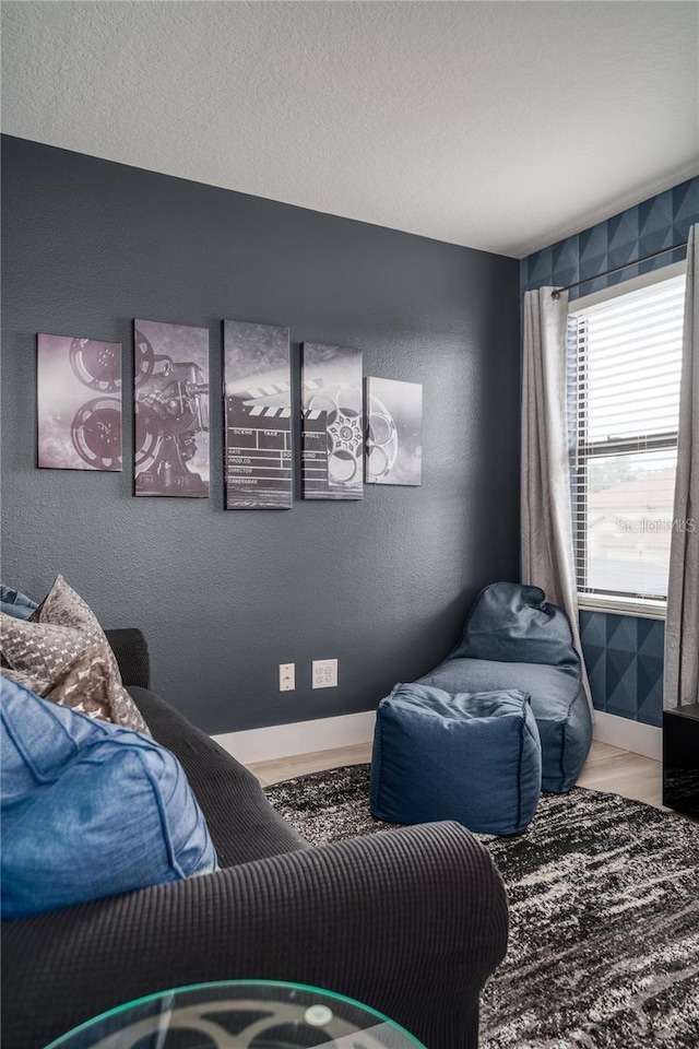 interior space with a textured ceiling and hardwood / wood-style flooring