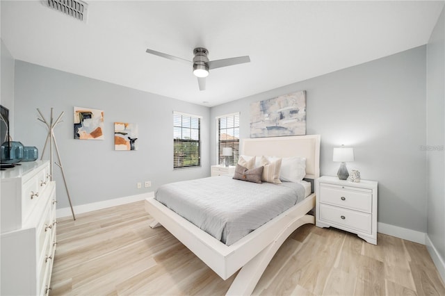 bedroom featuring light wood-type flooring and ceiling fan