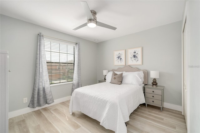 bedroom with ceiling fan and light hardwood / wood-style floors