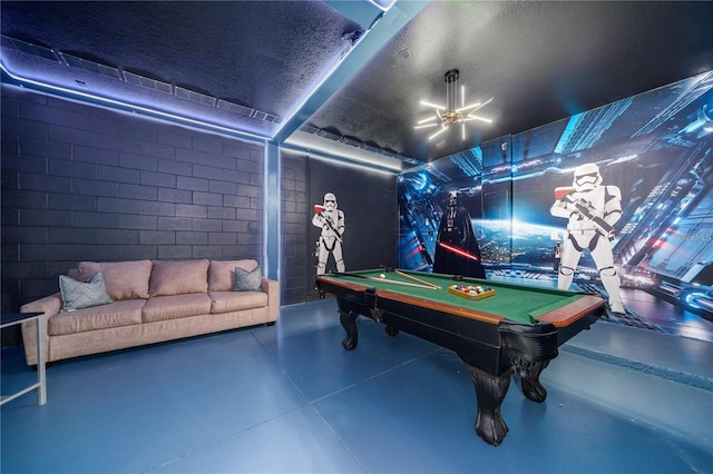 recreation room featuring concrete flooring and pool table