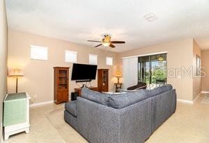 living room featuring ceiling fan