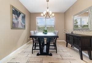 dining area featuring an inviting chandelier