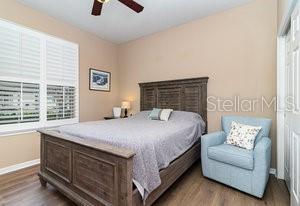 bedroom featuring ceiling fan and hardwood / wood-style floors