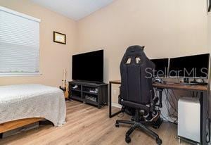 bedroom with wood-type flooring