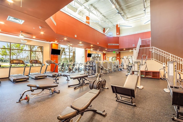 gym with a towering ceiling