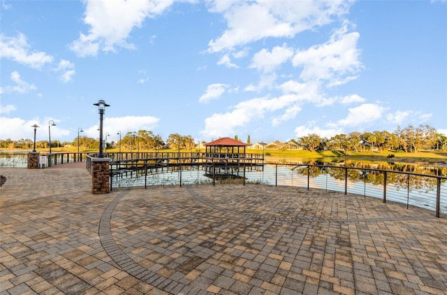 exterior space featuring a gazebo and a water view