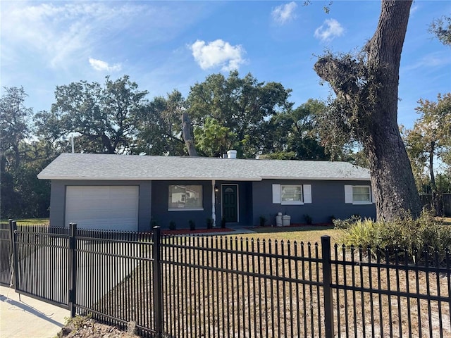 ranch-style home featuring a garage