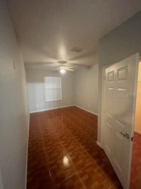 empty room featuring ceiling fan