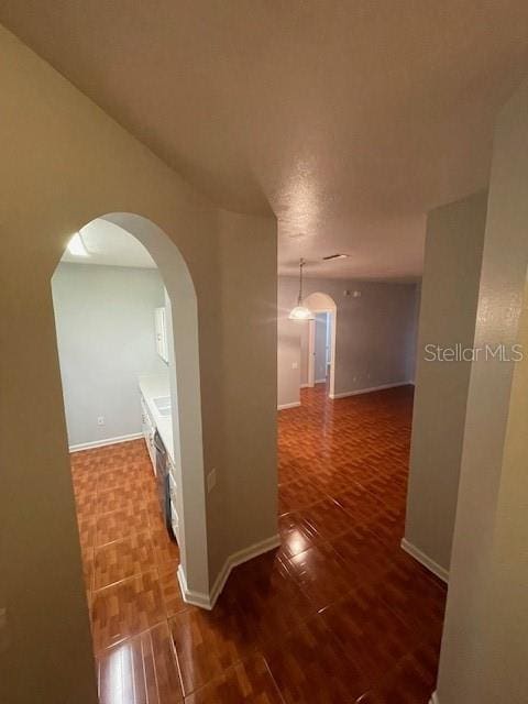 hallway featuring hardwood / wood-style flooring