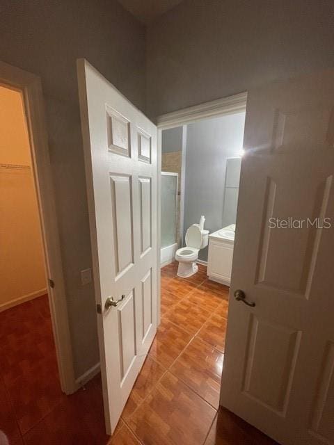 bathroom with tile patterned floors and toilet