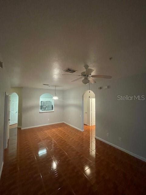 empty room featuring ceiling fan