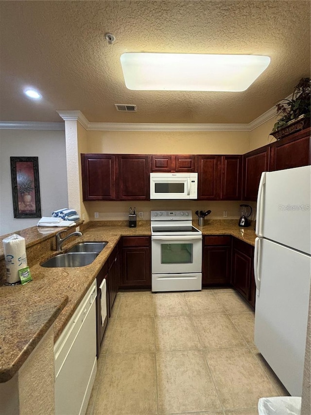 kitchen with white appliances, sink, ornamental molding, a textured ceiling, and kitchen peninsula