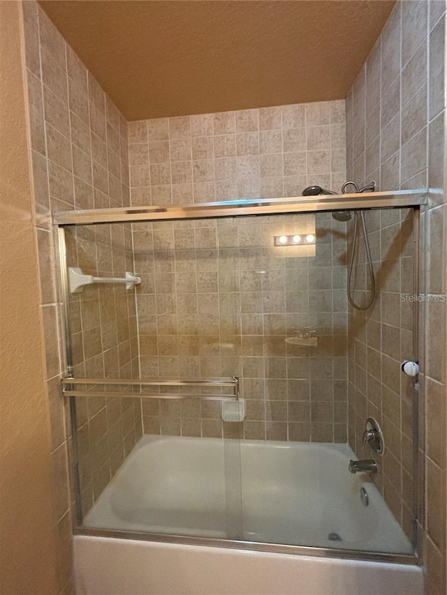 bathroom with enclosed tub / shower combo