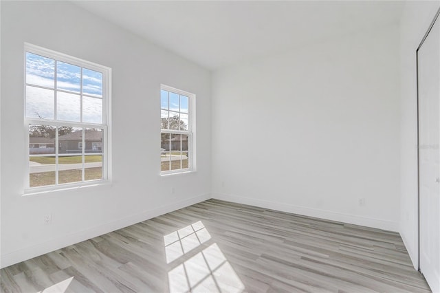 empty room with light wood-type flooring