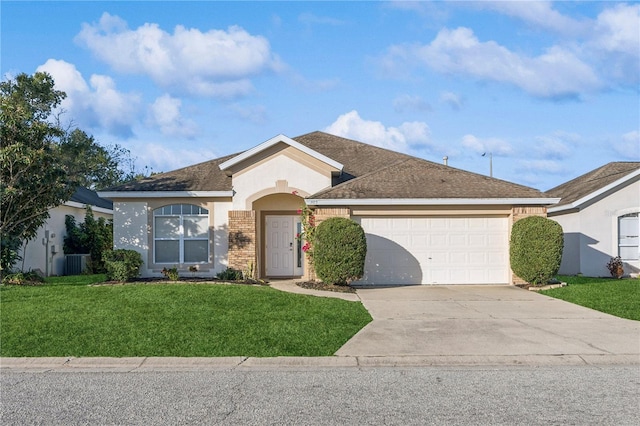 ranch-style home featuring central AC unit, a front yard, and a garage