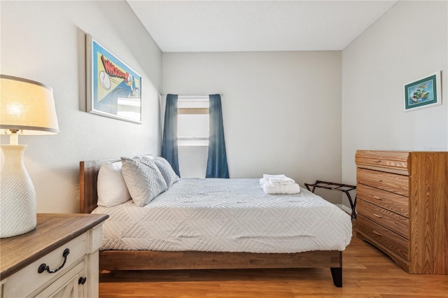 bedroom featuring light wood-type flooring