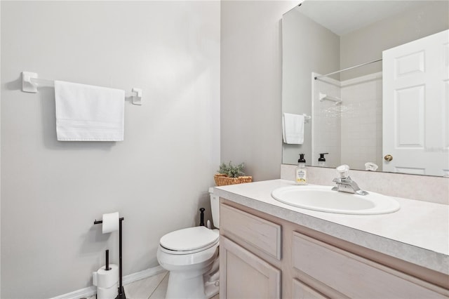 bathroom with a shower, vanity, tile patterned flooring, and toilet