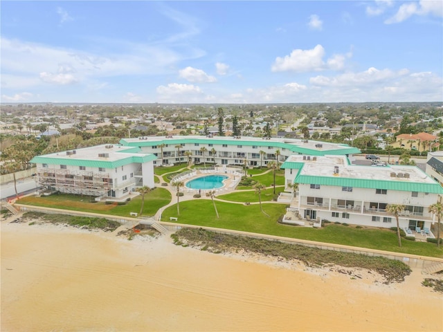 bird's eye view featuring a view of the beach and a water view