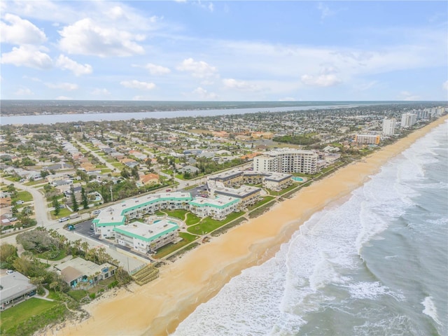 birds eye view of property featuring a water view and a view of the beach