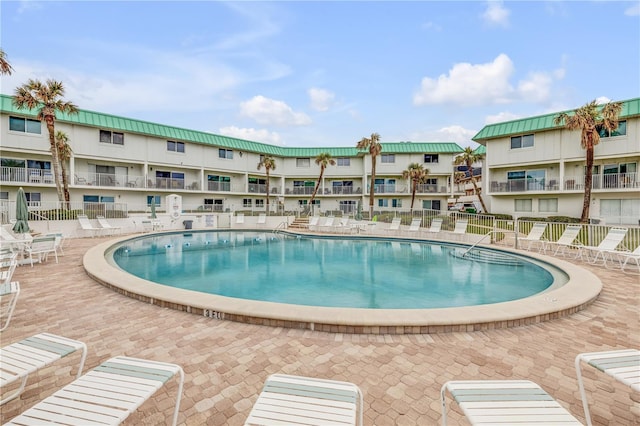 view of pool featuring a patio