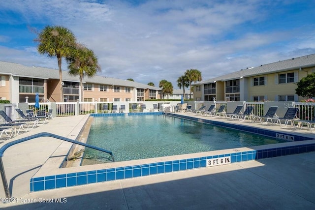 view of swimming pool featuring a patio area