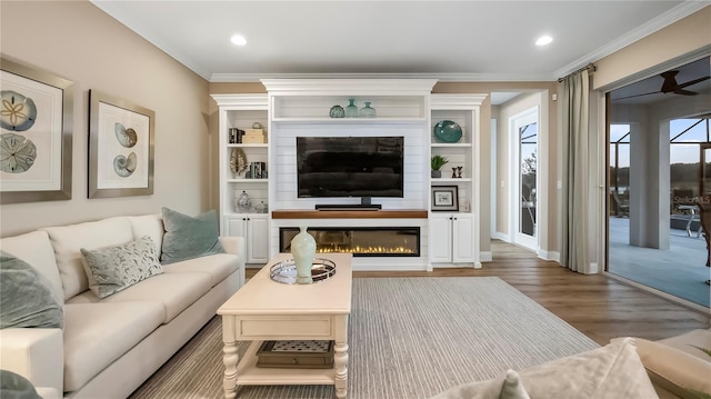 living room featuring a fireplace, crown molding, and dark wood-type flooring