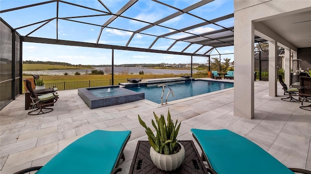 view of pool with a lanai, a patio area, pool water feature, and an in ground hot tub