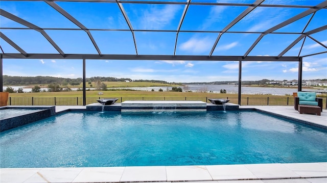 view of pool with pool water feature, an in ground hot tub, a water view, a patio, and glass enclosure