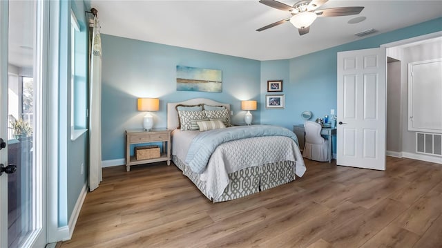 bedroom with hardwood / wood-style flooring and ceiling fan