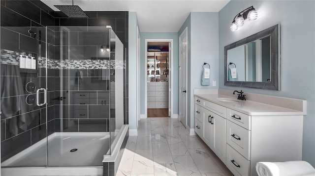 bathroom with vanity and a shower with shower door