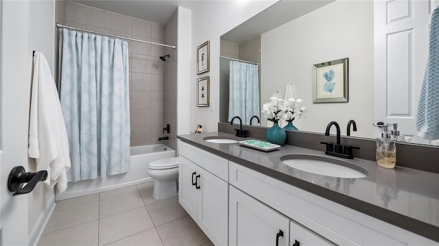 full bathroom featuring toilet, tile patterned flooring, shower / bath combo with shower curtain, and vanity