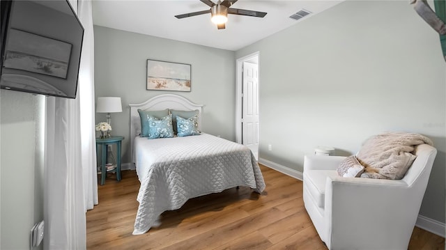 bedroom featuring ceiling fan and light hardwood / wood-style flooring