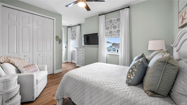 bedroom with a closet, ceiling fan, and wood-type flooring