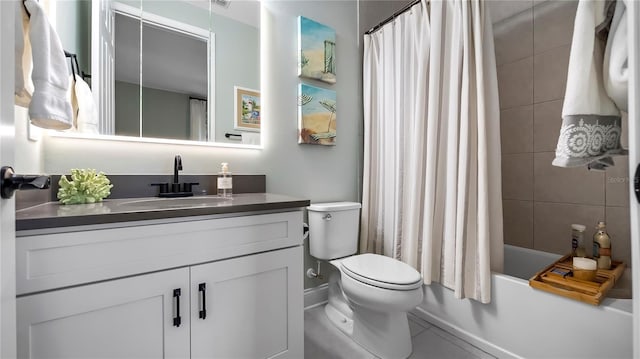 full bathroom featuring toilet, vanity, tile patterned floors, and shower / bath combination with curtain