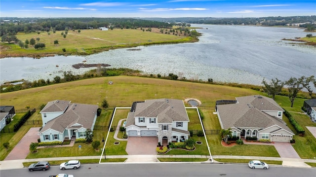 birds eye view of property with a water view