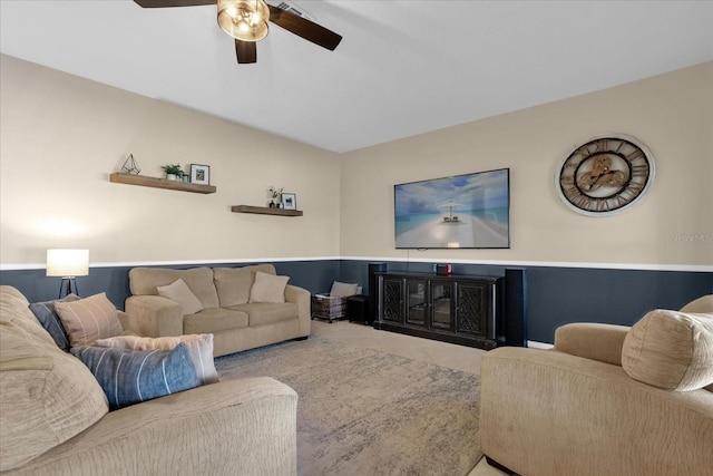 living room with tile patterned floors and ceiling fan