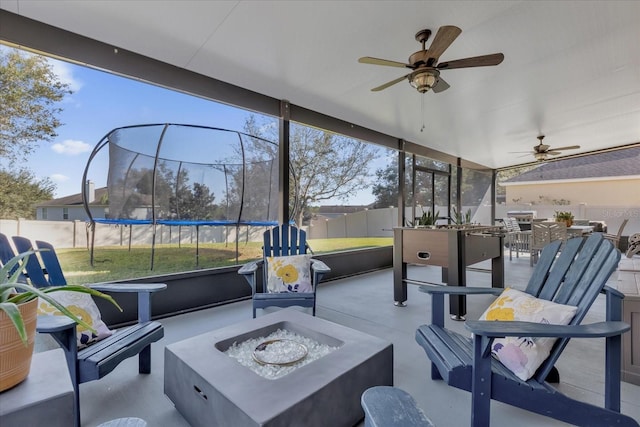 sunroom / solarium with ceiling fan