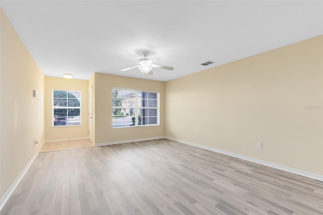 unfurnished room featuring ceiling fan and light hardwood / wood-style floors