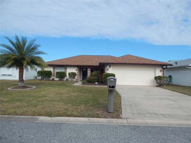 ranch-style house with a front yard and a garage