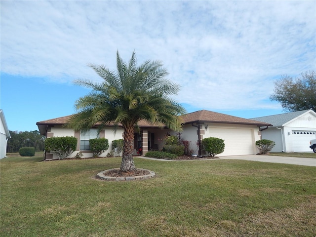 view of front of property featuring a garage and a front yard