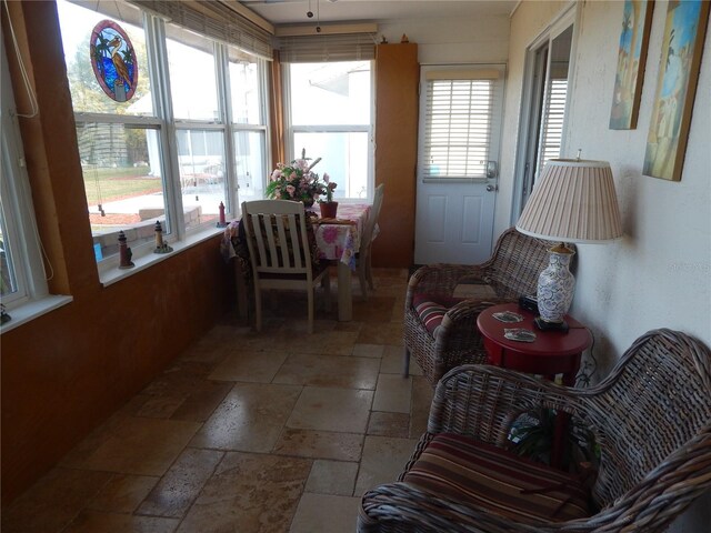 sunroom / solarium featuring a healthy amount of sunlight