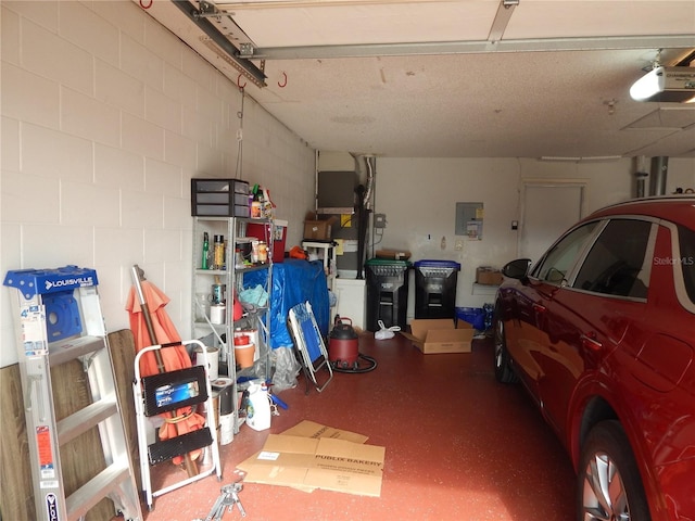 garage with electric panel and a garage door opener