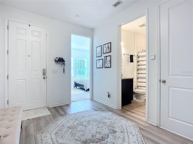 hall with light wood-type flooring