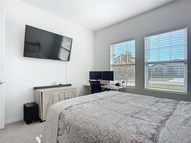 bedroom featuring light carpet