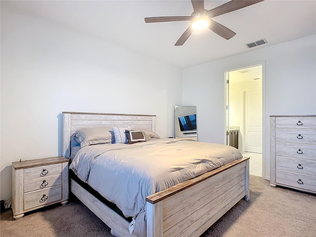 bedroom with light colored carpet and ceiling fan