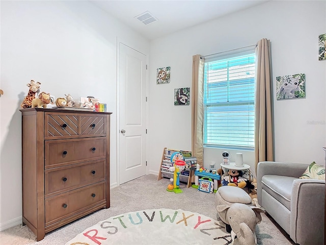 playroom featuring light colored carpet