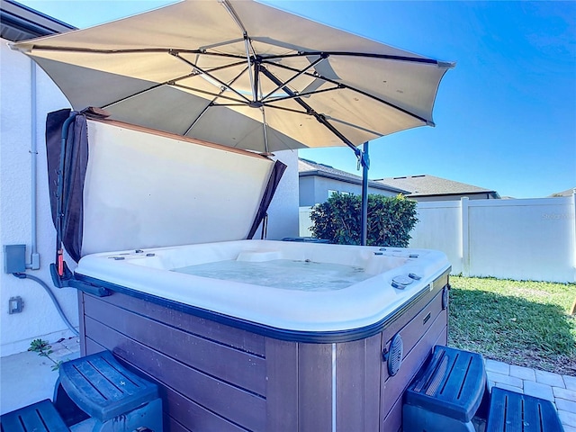 view of patio / terrace featuring a hot tub